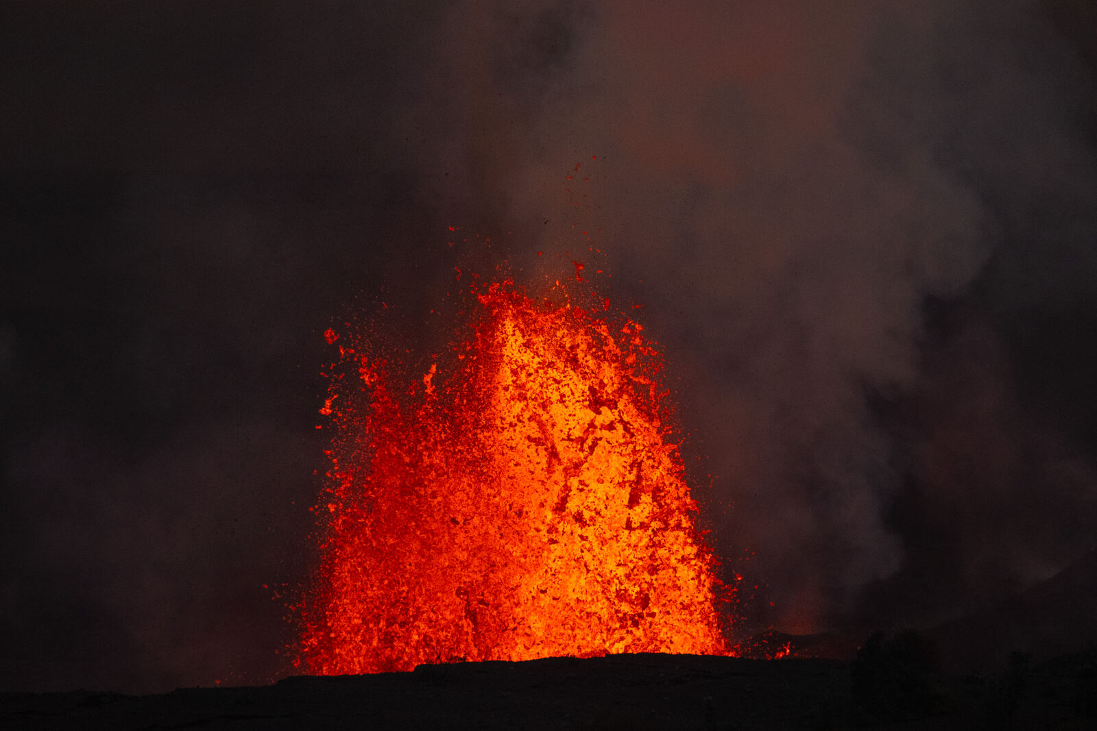Lava fountain erupting at night