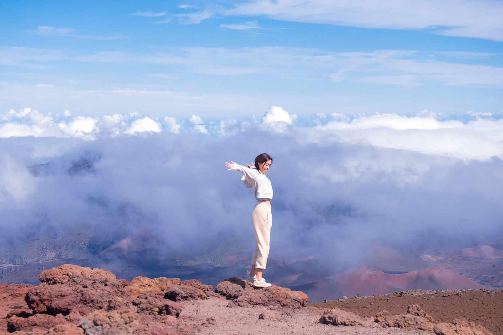 Standing above the clouds on a volcanic summit