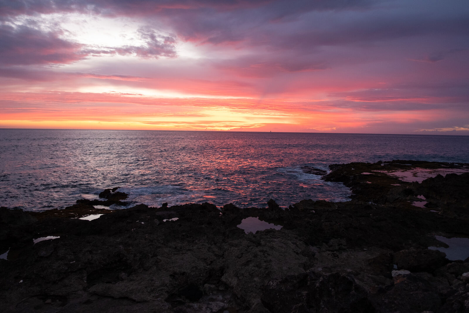 Pink and purple sunset over tide pools