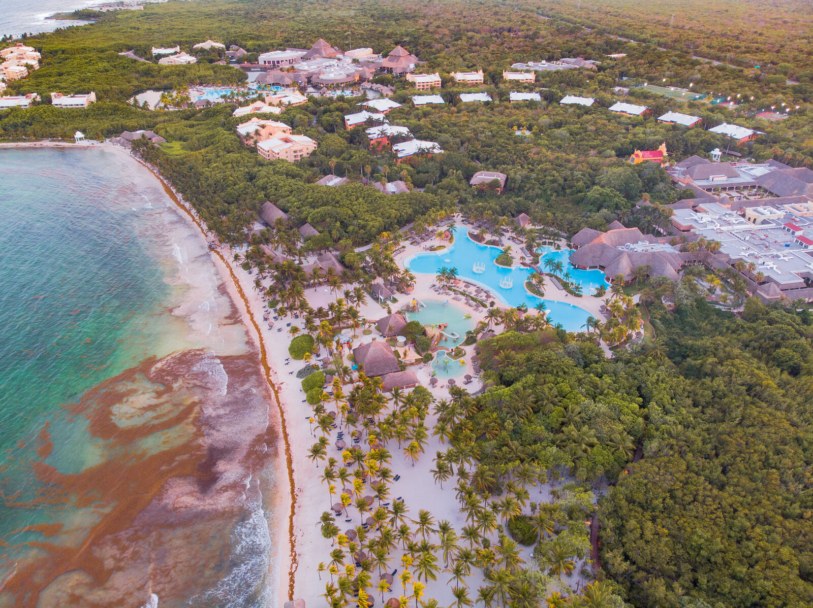 Aerial of a resort coastline at dusk
