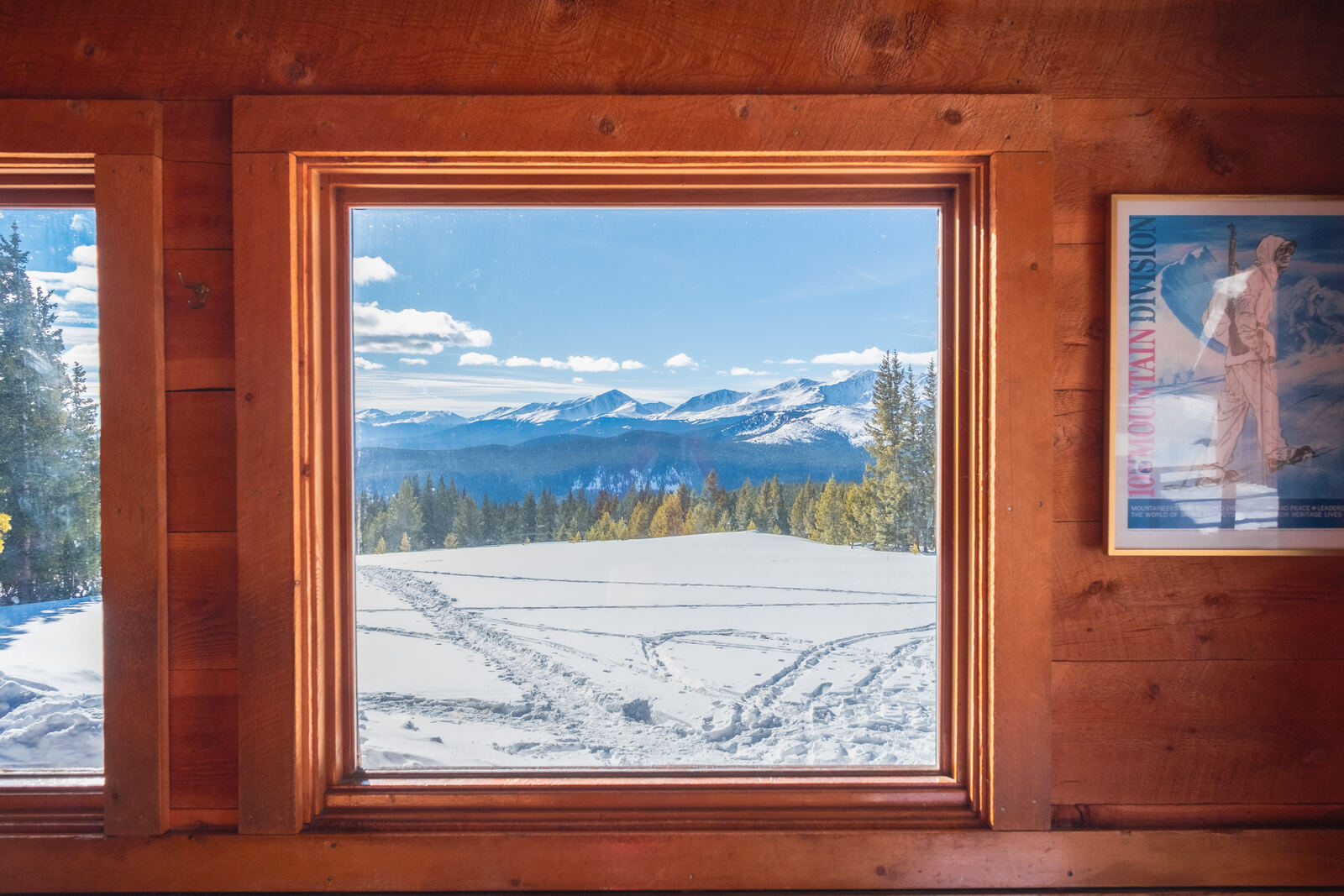 Snowy peaks framed in a cabin window