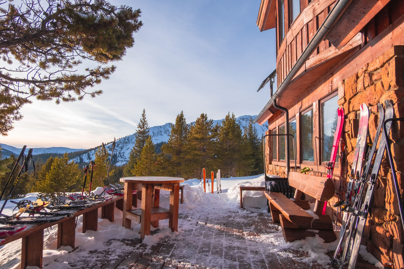 Lodge deck with skis at sunrise
